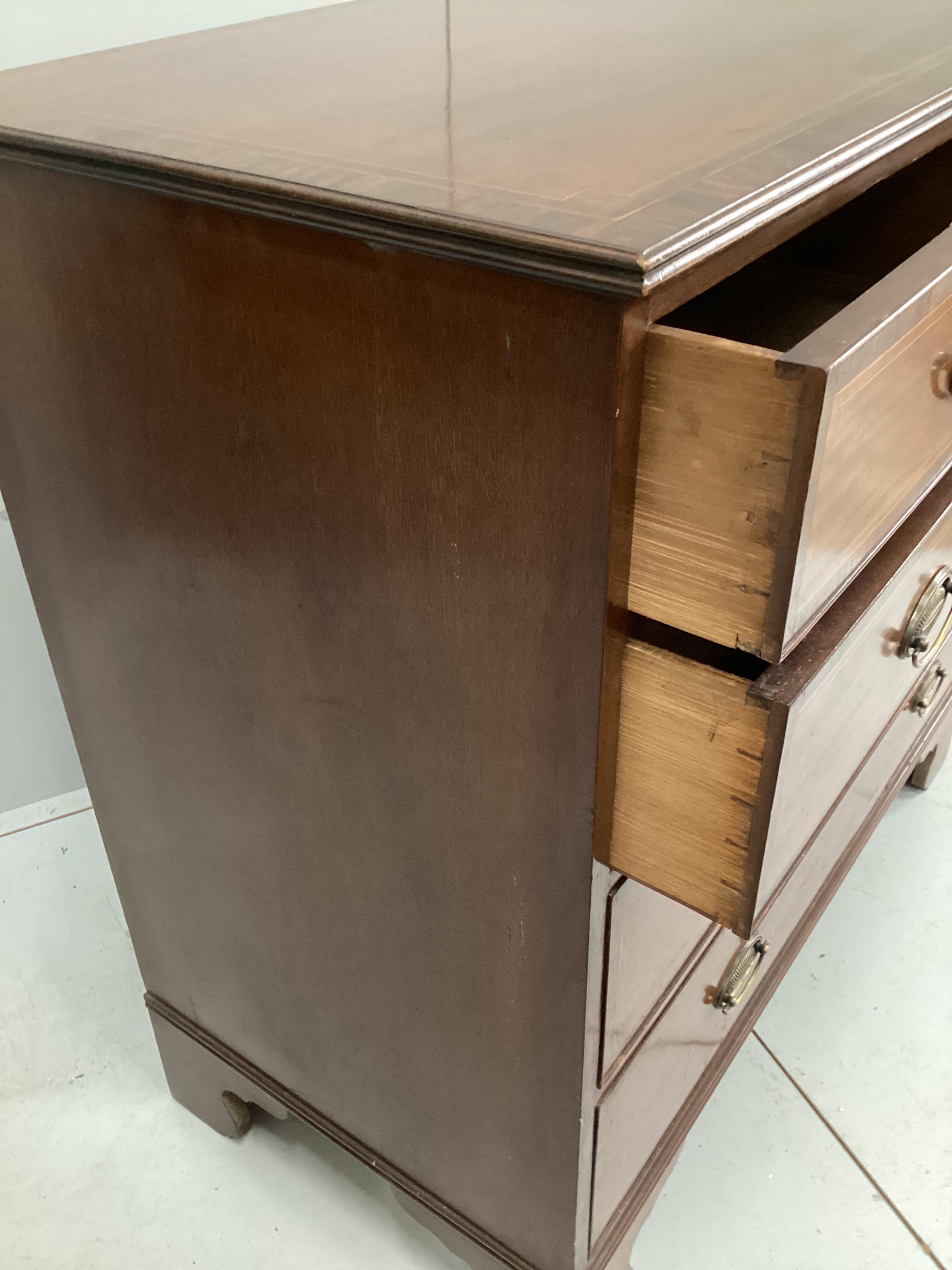 A George III style banded mahogany five drawer chest stamped Edwards and Roberts, width 106cm, depth 54cm, height 102cm